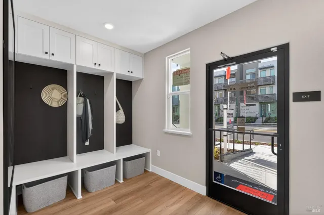 a view of walk in closet with living room