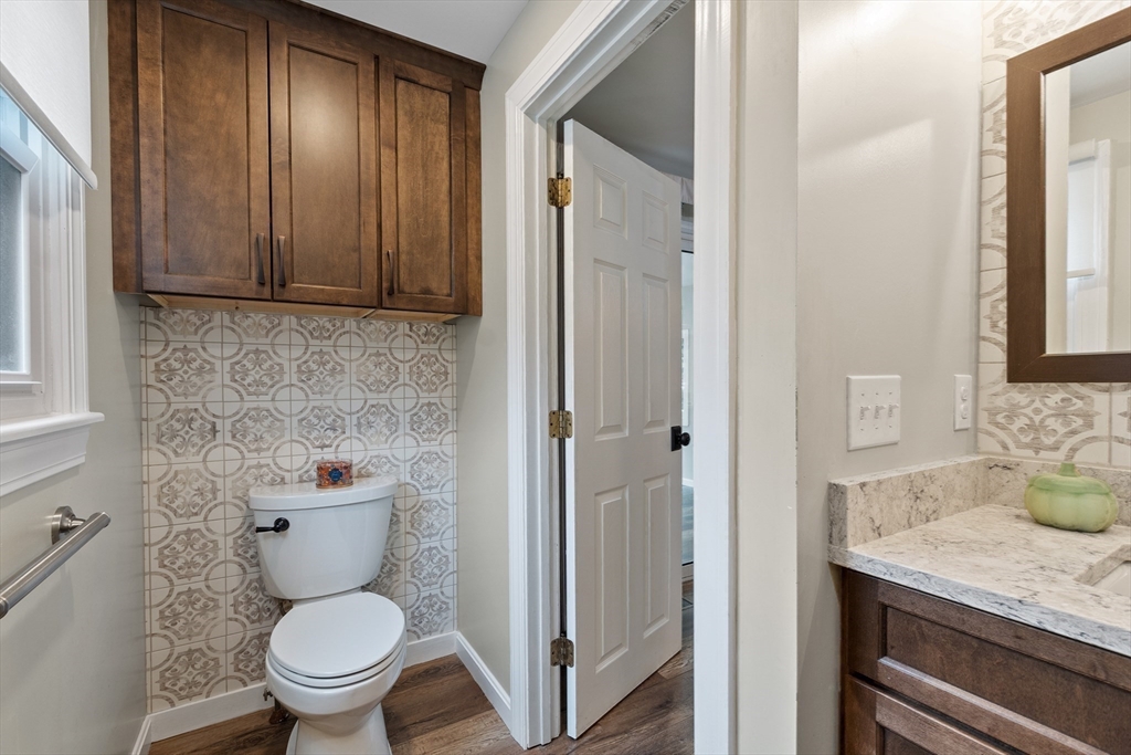 84 Constance Drive Lowell, MA 01854 - Photo 13 of 27 a bathroom with a granite countertop toilet and a sink