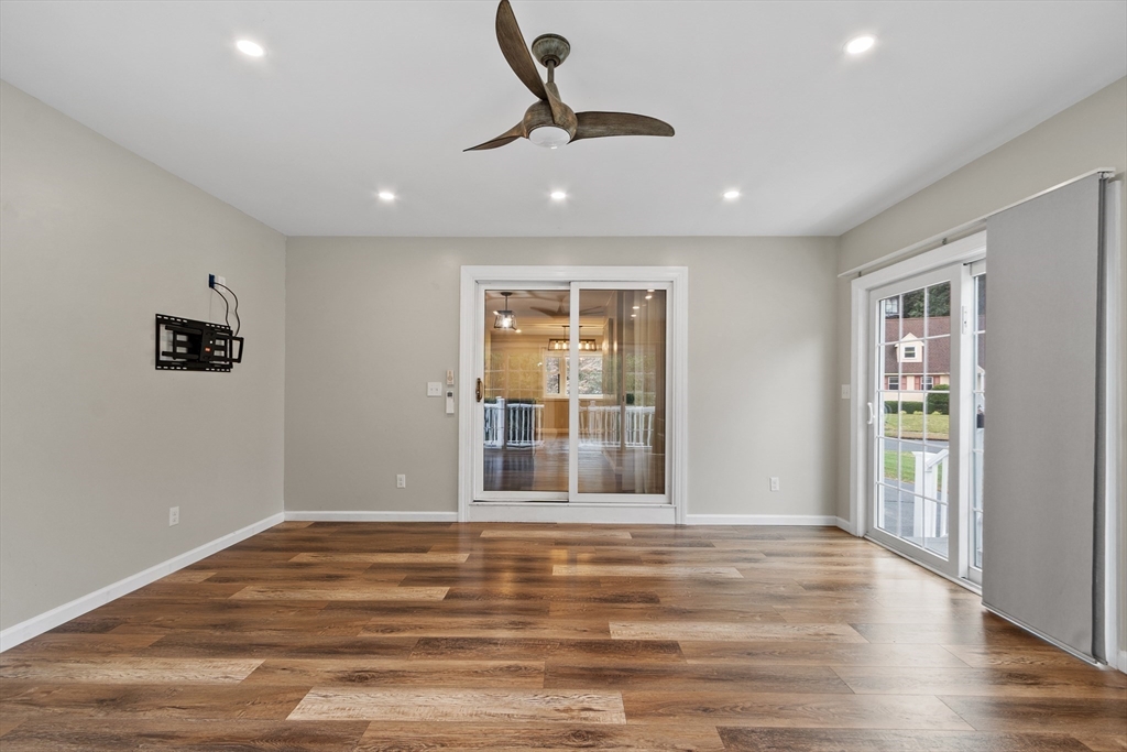 84 Constance Drive Lowell, MA 01854 - Photo 15 of 27 a view of an empty room with wooden floor and a window