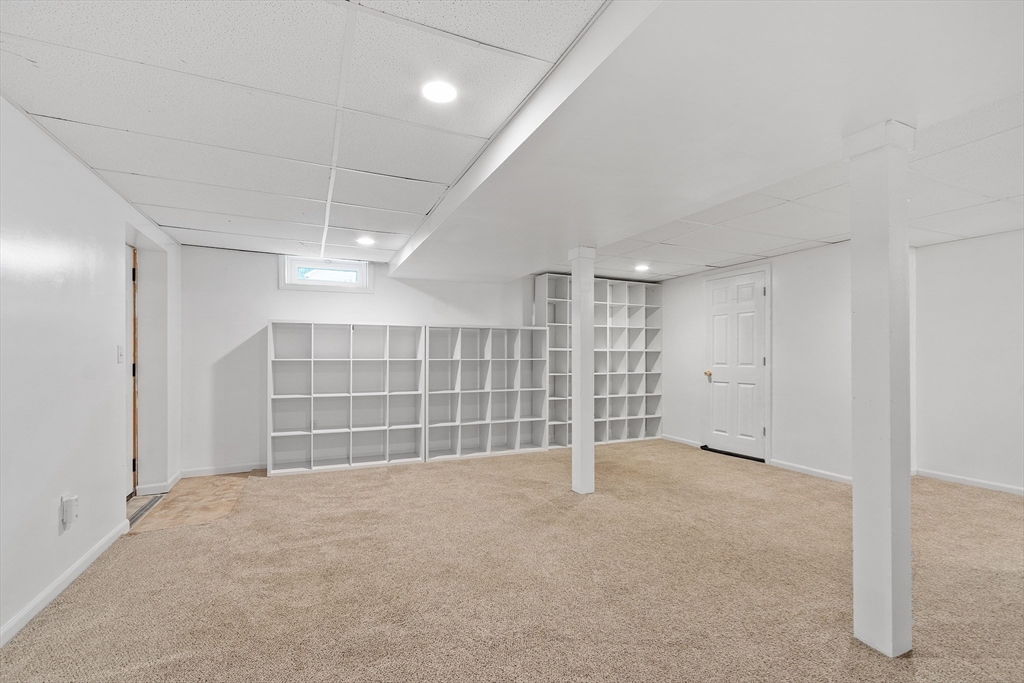 84 Constance Drive Lowell, MA 01854 - Photo 19 of 27 a view of an empty room with a garage