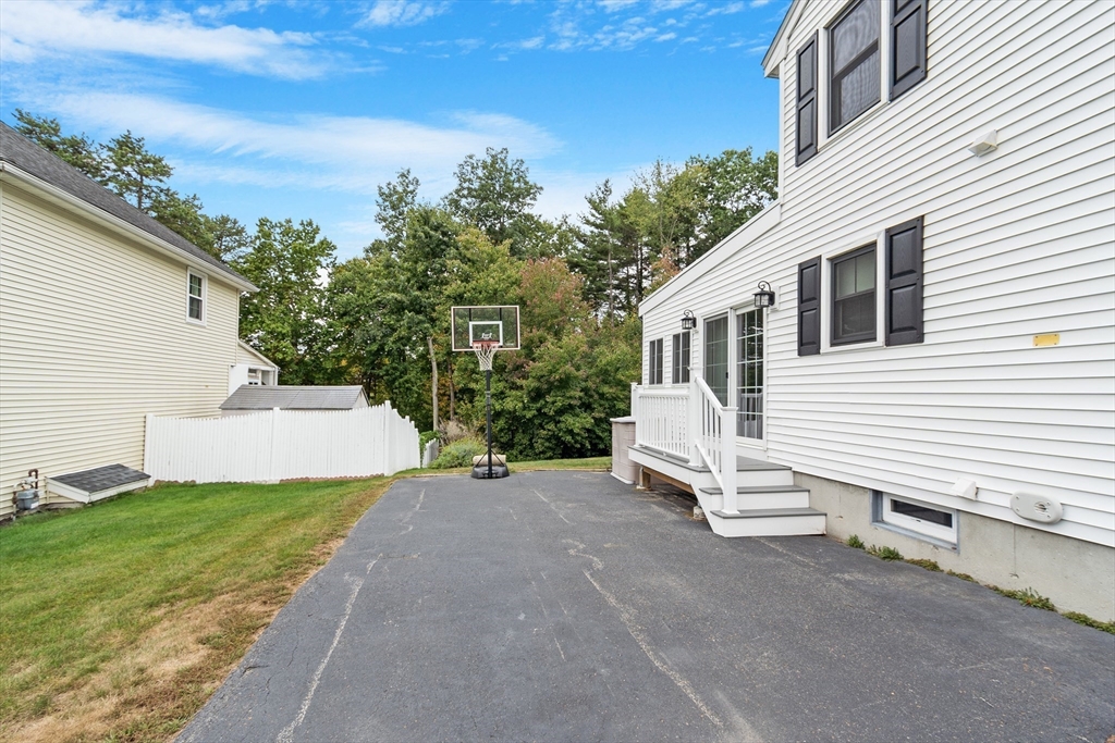 84 Constance Drive Lowell, MA 01854 - Photo 26 of 27 a view of a house with a yard