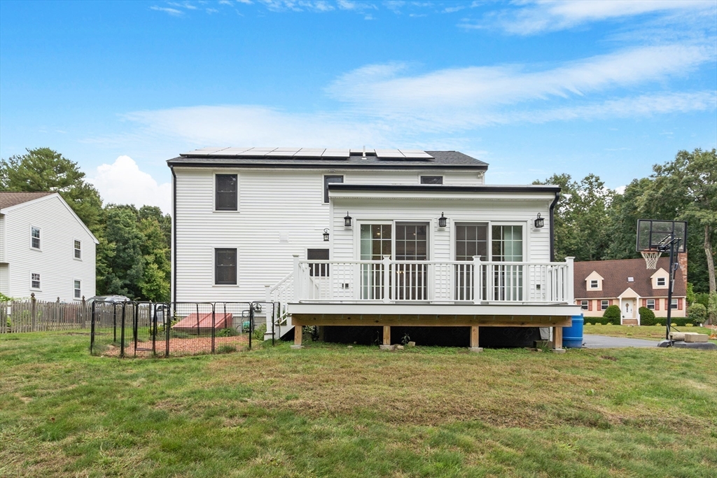 84 Constance Drive Lowell, MA 01854 - Photo 27 of 27 a view of a house with a backyard