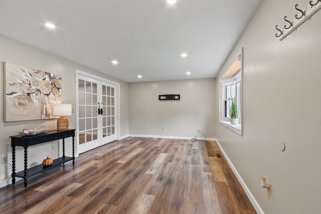 84 Constance Drive Lowell, MA 01854 - Photo 4 of 27 wooden floor in an empty room with a window