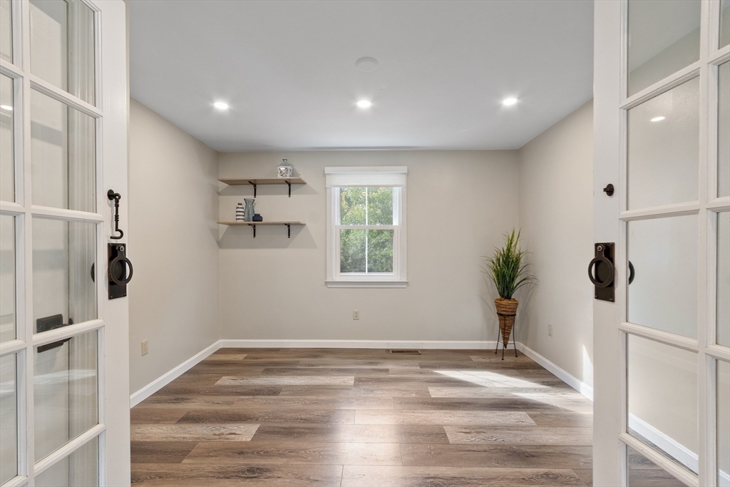84 Constance Drive Lowell, MA 01854 - Photo 5 of 27 a view of empty room with wooden floor and window