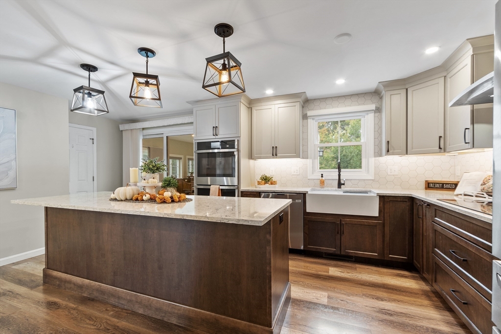 84 Constance Drive Lowell, MA 01854 - Photo 6 of 27 a kitchen with cabinets a sink and appliances