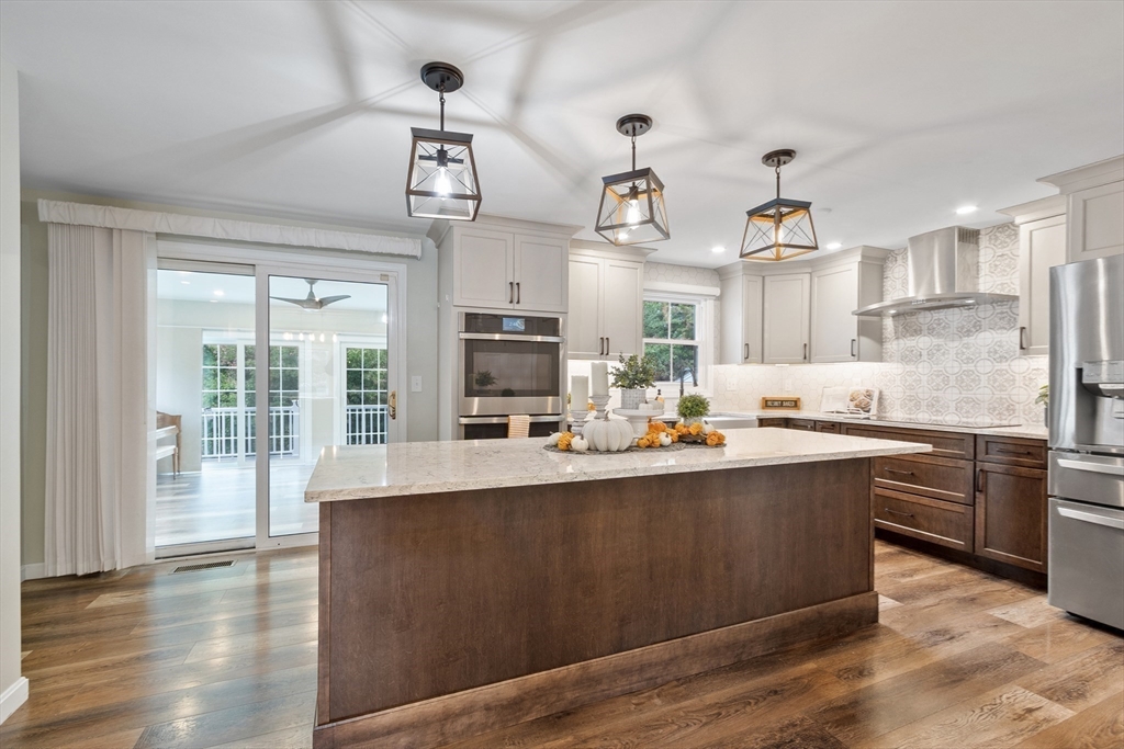 84 Constance Drive Lowell, MA 01854 - Photo 7 of 27 a large kitchen with lots of counter space and a sink