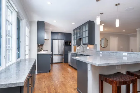 a dining room with furniture and wooden floor