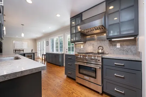 a view of a patio with table and chairs and potted plants