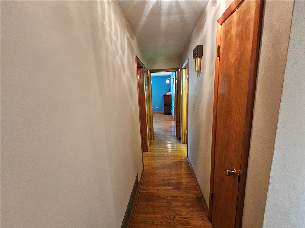 3998 Willowcrest Road Beavercreek, OH 45430 - Photo 29 of 41 An inviting hallway with polished hardwood floors leads to bright rooms, promising comfortable living.