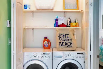 a kitchen with stainless steel appliances kitchen island granite countertop a refrigerator and a stove top oven