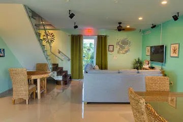 a balcony with table and chairs