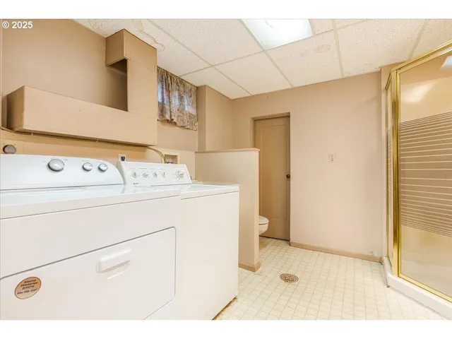 a utility room with dryer and washer