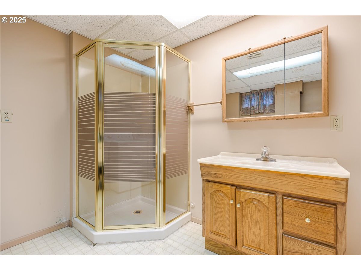 5925 Northeast 27th Avenue Portland, OR 97211 - Photo 19 of 25 a bathroom with a granite countertop sink mirror and