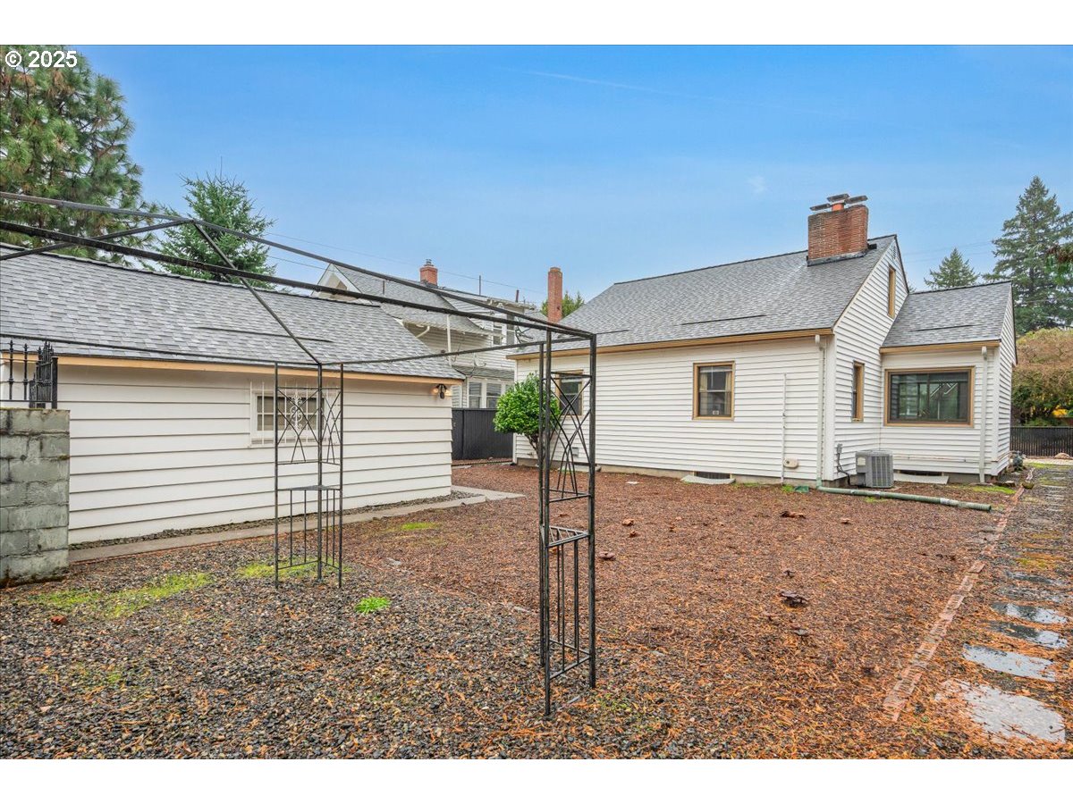 5925 Northeast 27th Avenue Portland, OR 97211 - Photo 23 of 25 a view of a house with a backyard