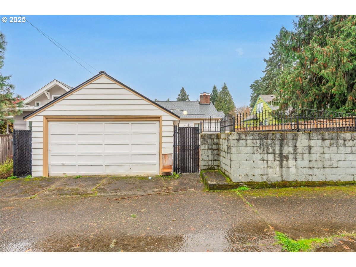 5925 Northeast 27th Avenue Portland, OR 97211 - Photo 24 of 25 a view of a house with a wooden fence