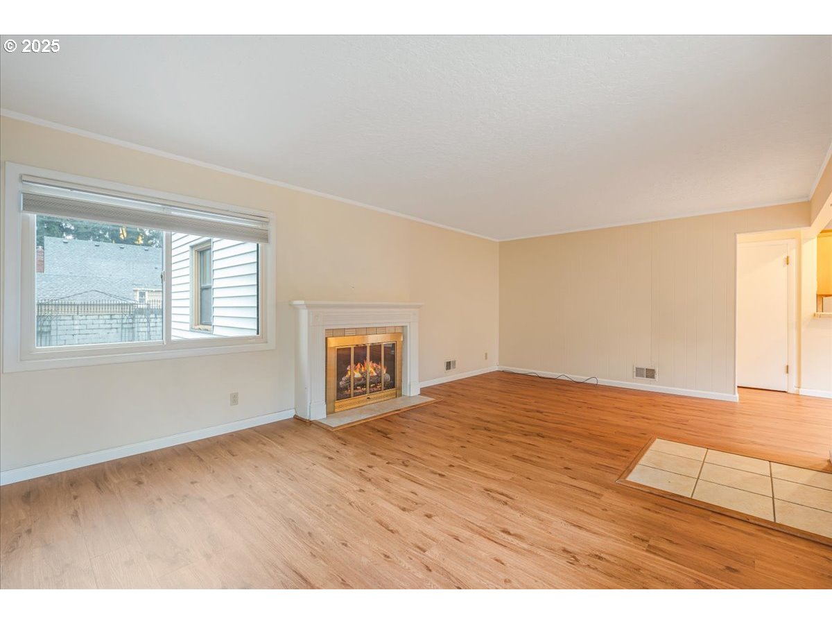 5925 Northeast 27th Avenue Portland, OR 97211 - Photo 4 of 25 a view of an empty room with a window