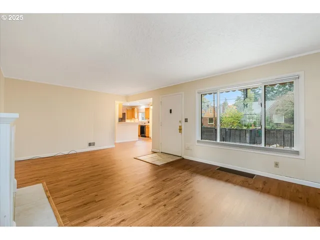 a view of an empty room with a window