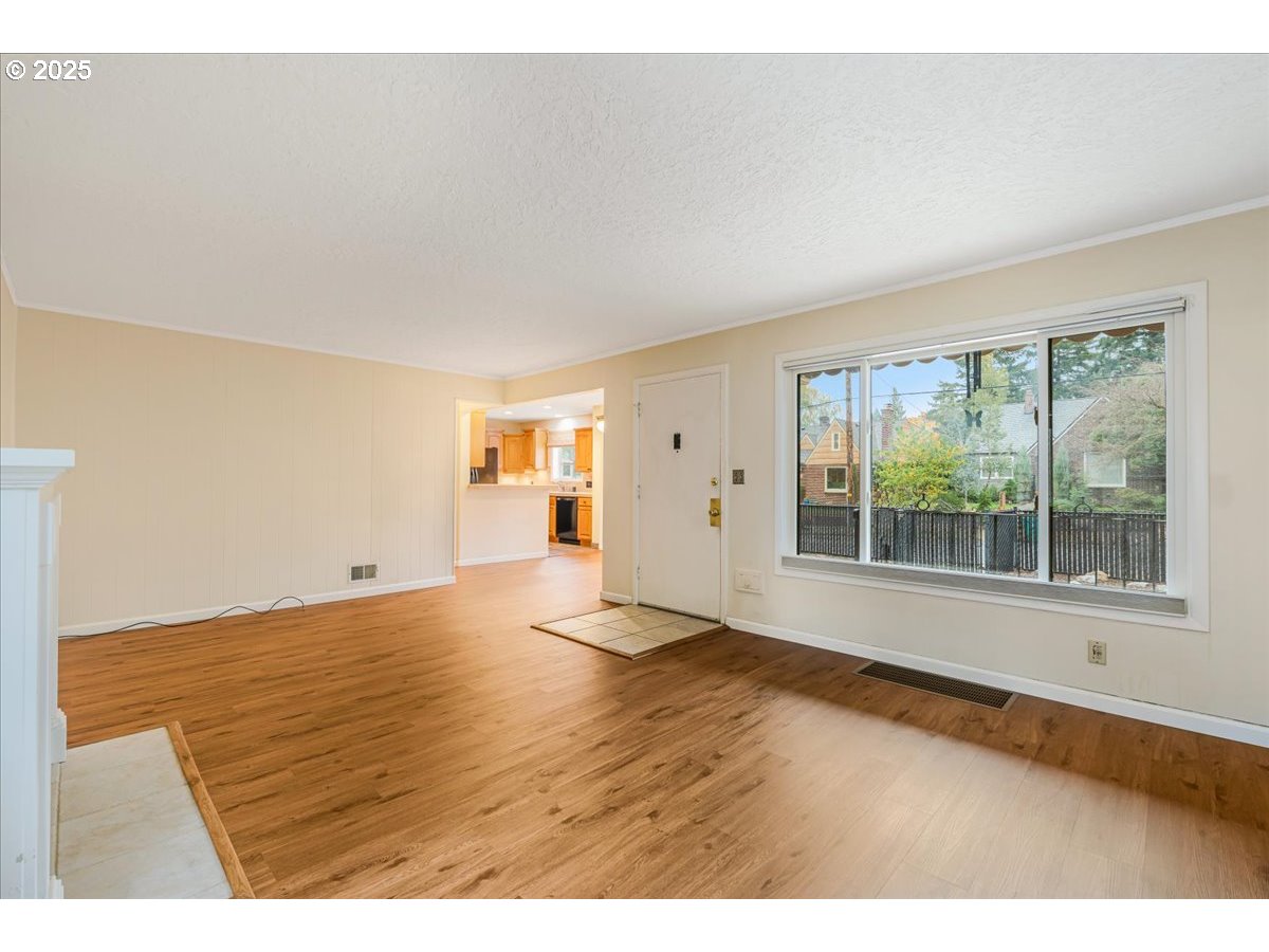 5925 Northeast 27th Avenue Portland, OR 97211 - Photo 5 of 25 a view of an empty room with a window