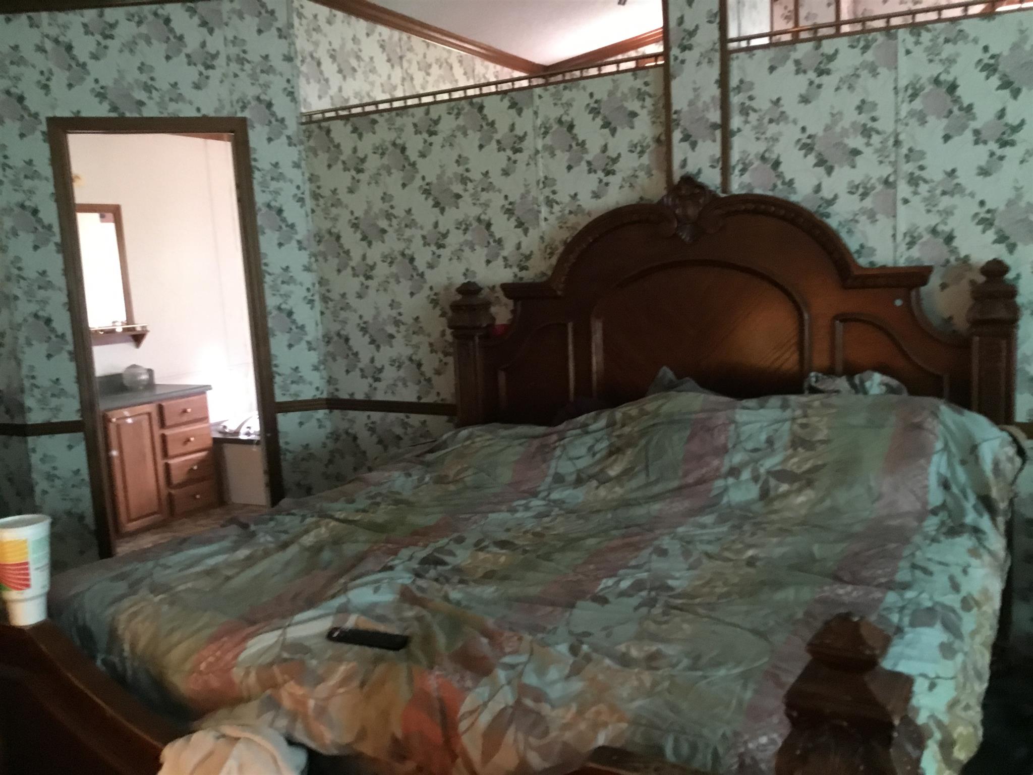2085 Sugar Camp Road Springfield, TN 37172 - Photo 3 of 18 a bed sitting in a bedroom next to a brick wall