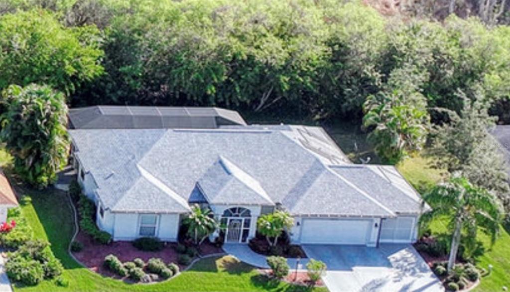 5871 Wilson Road Venice, FL 34293 - Photo 1 of 1 an aerial view of a house with a yard