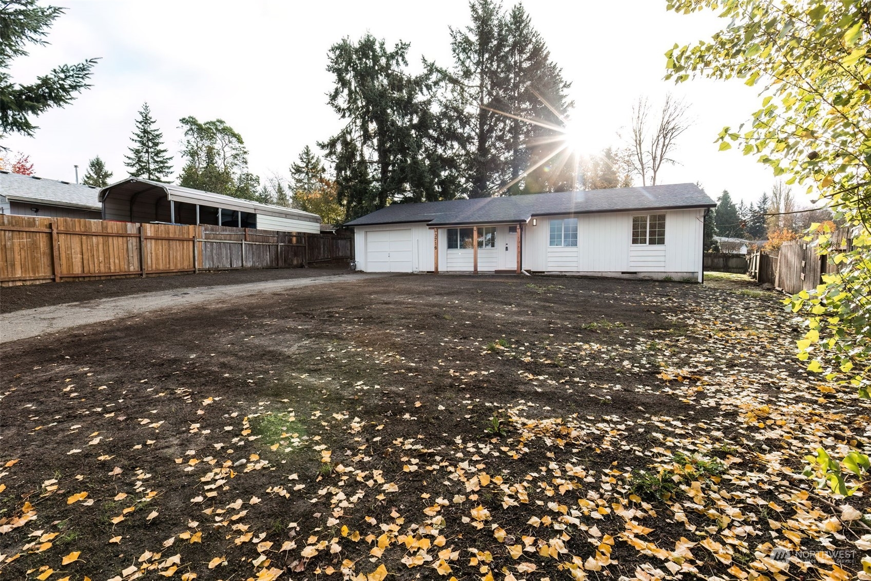 3719 Rhapsody Drive Southeast Port Orchard, WA 98366 - Photo 2 of 40 a view of a house with a tree in the background