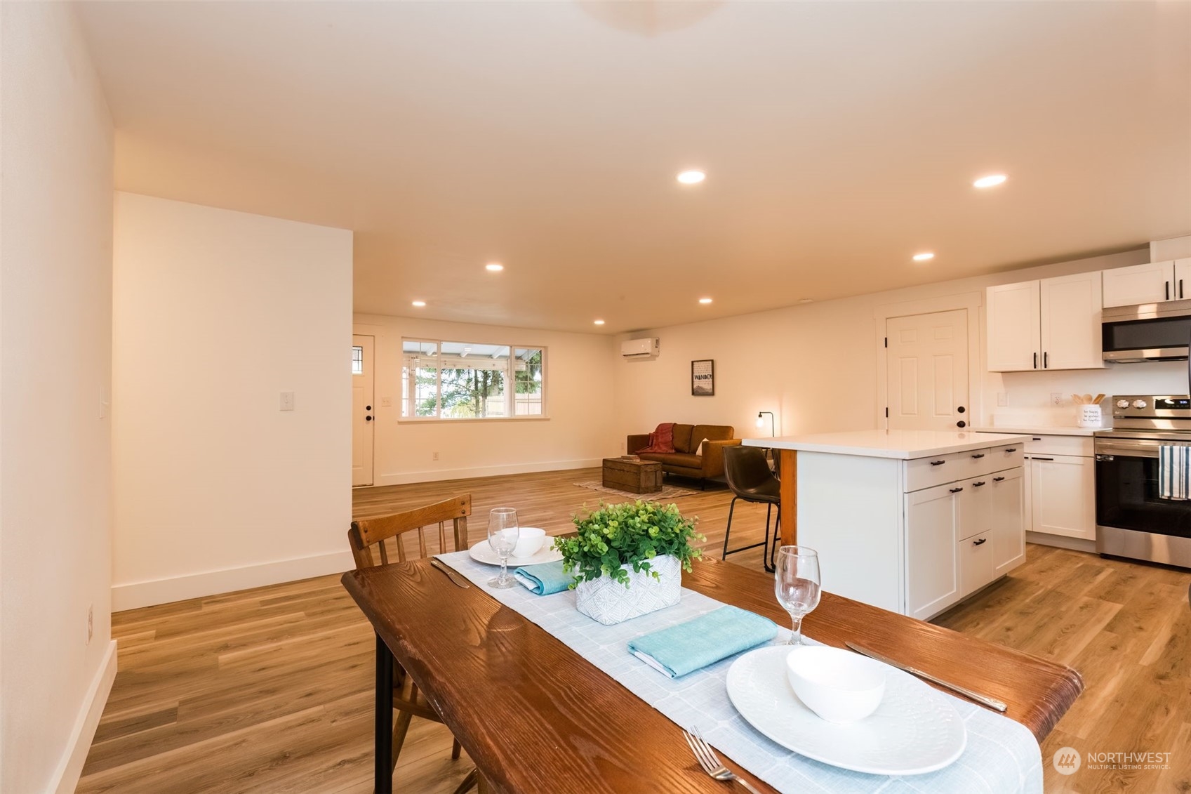 3719 Rhapsody Drive Southeast Port Orchard, WA 98366 - Photo 21 of 40 a kitchen with a sink dining table and chairs