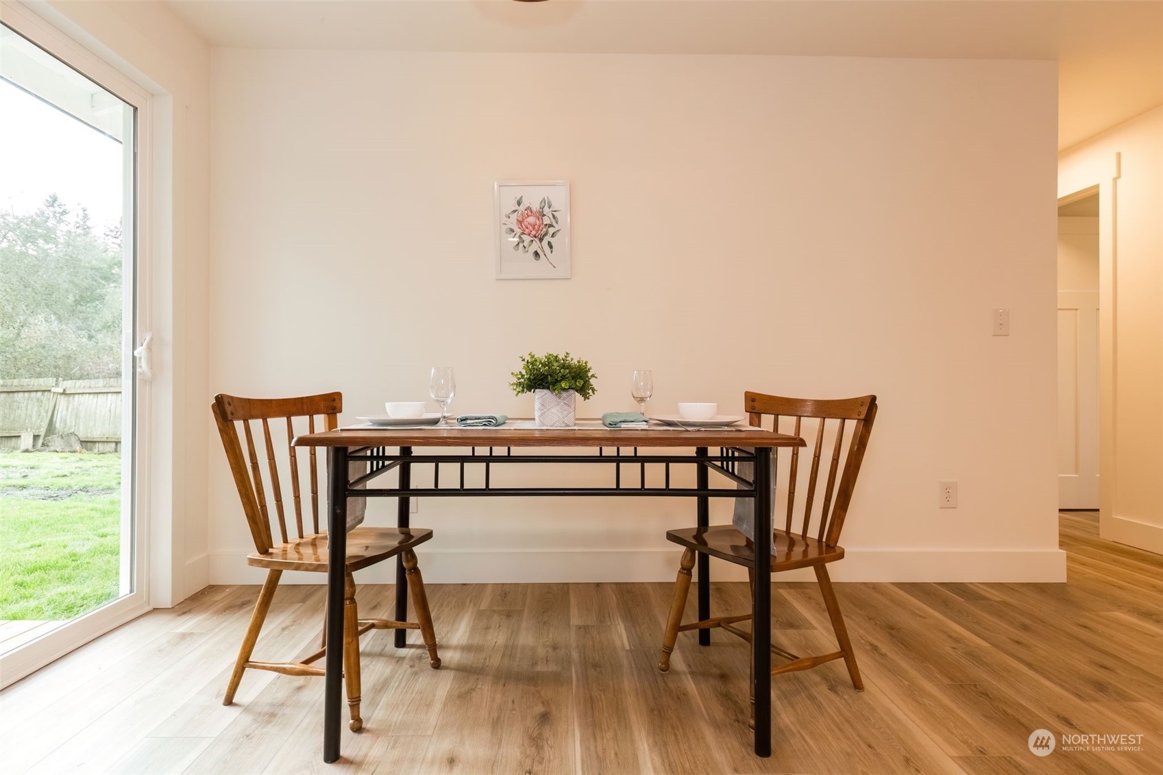 3719 Rhapsody Drive Southeast Port Orchard, WA 98366 - Photo 22 of 40 a view of a dining room with furniture wooden floor and a window