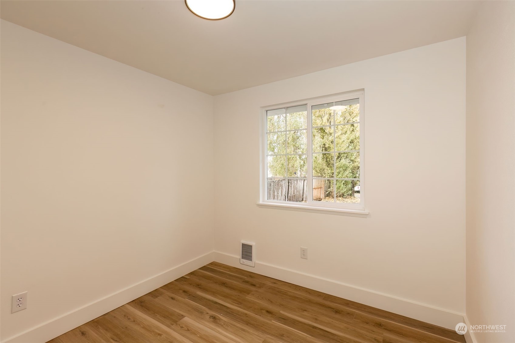 3719 Rhapsody Drive Southeast Port Orchard, WA 98366 - Photo 24 of 40 an empty room with wooden floor and windows