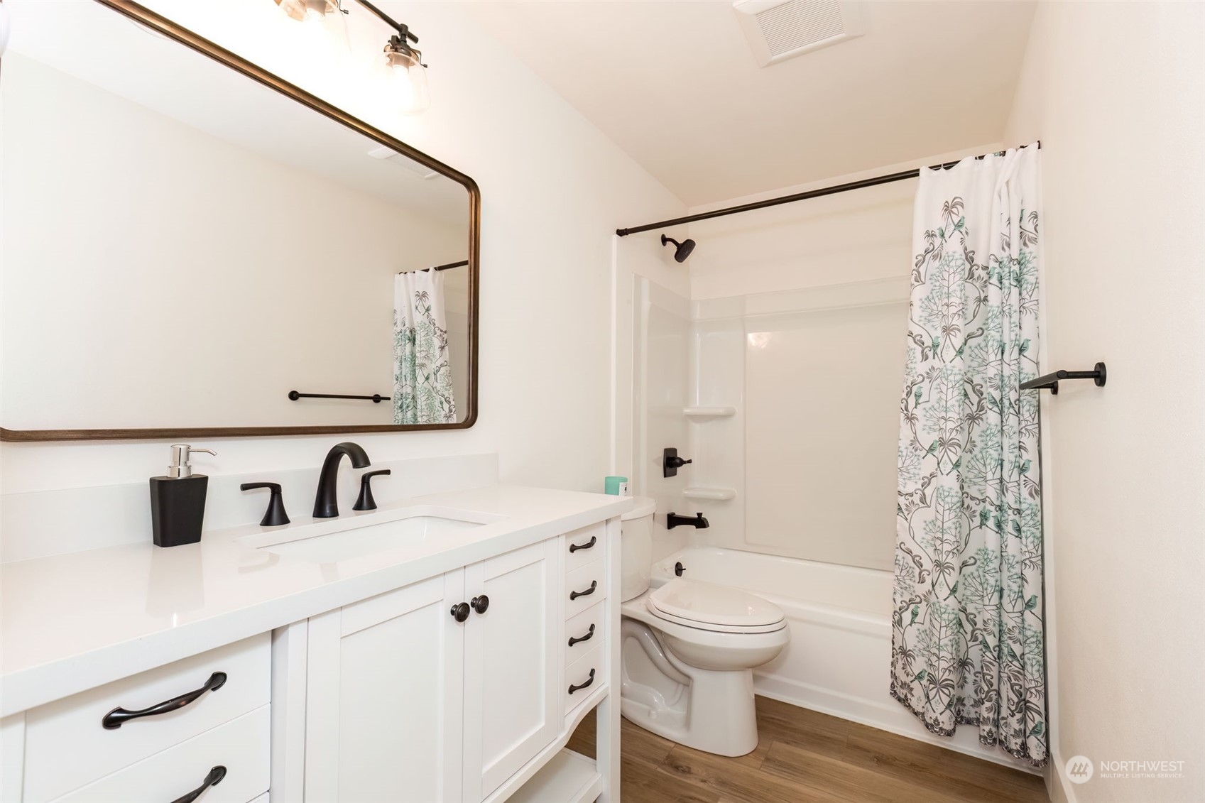 3719 Rhapsody Drive Southeast Port Orchard, WA 98366 - Photo 26 of 40 a bathroom with a double vanity sink toilet and shower