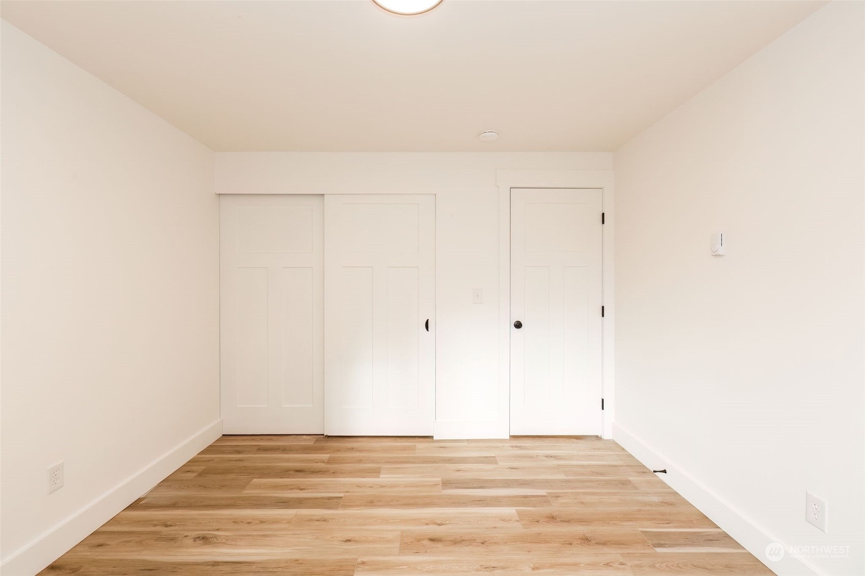 3719 Rhapsody Drive Southeast Port Orchard, WA 98366 - Photo 32 of 40 a view of a room with wooden floor