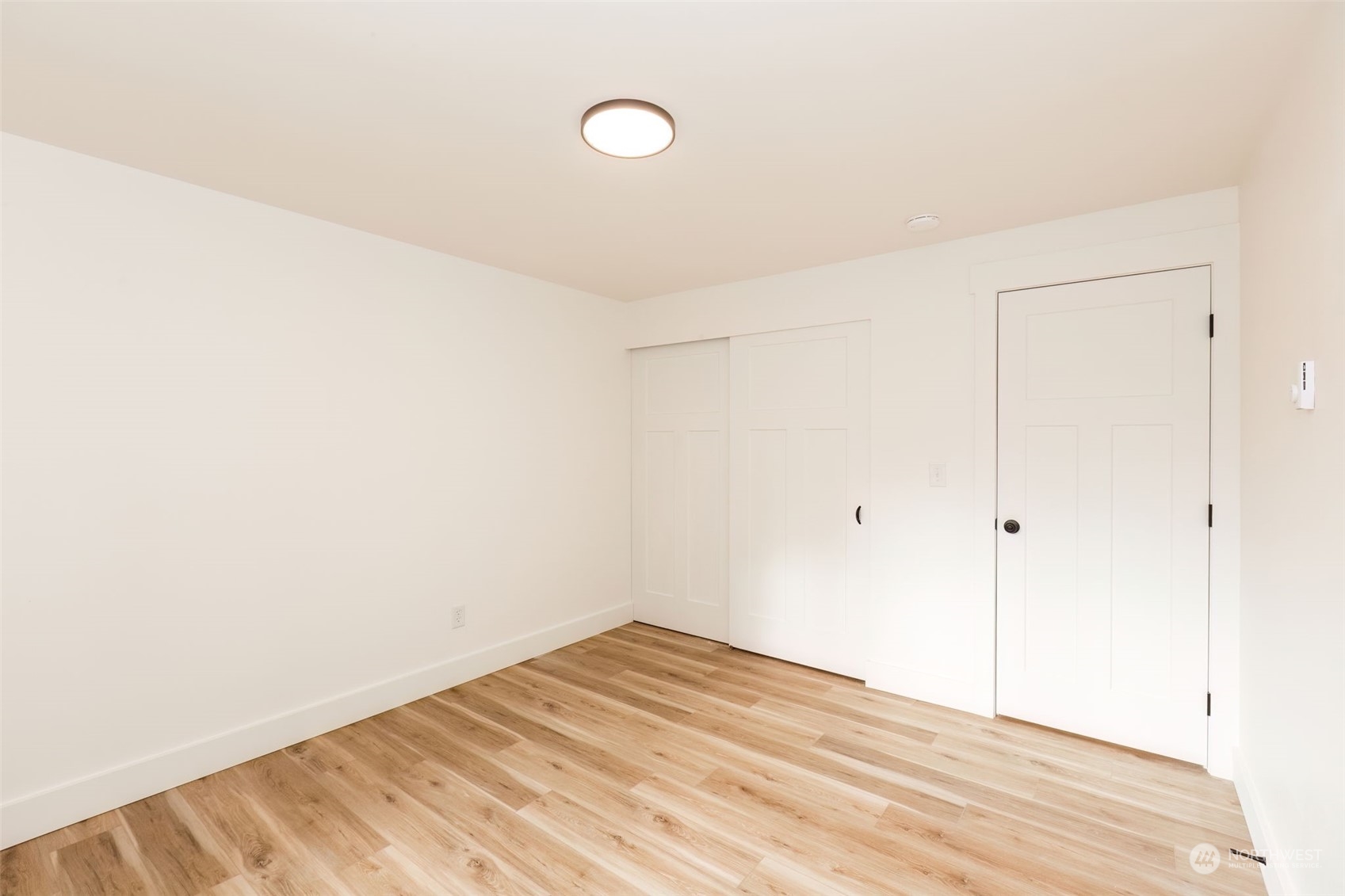 3719 Rhapsody Drive Southeast Port Orchard, WA 98366 - Photo 33 of 40 a view of a room with wooden floor