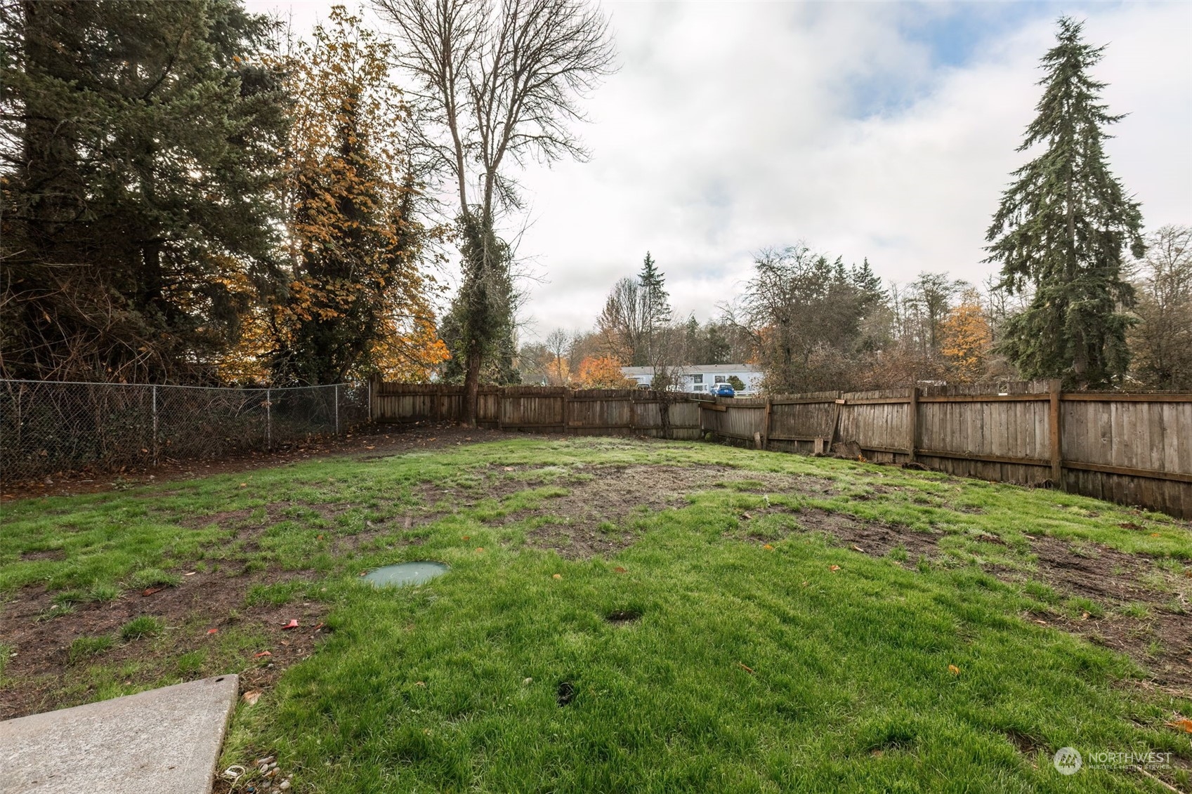 3719 Rhapsody Drive Southeast Port Orchard, WA 98366 - Photo 36 of 40 a backyard of a house with lots of green space
