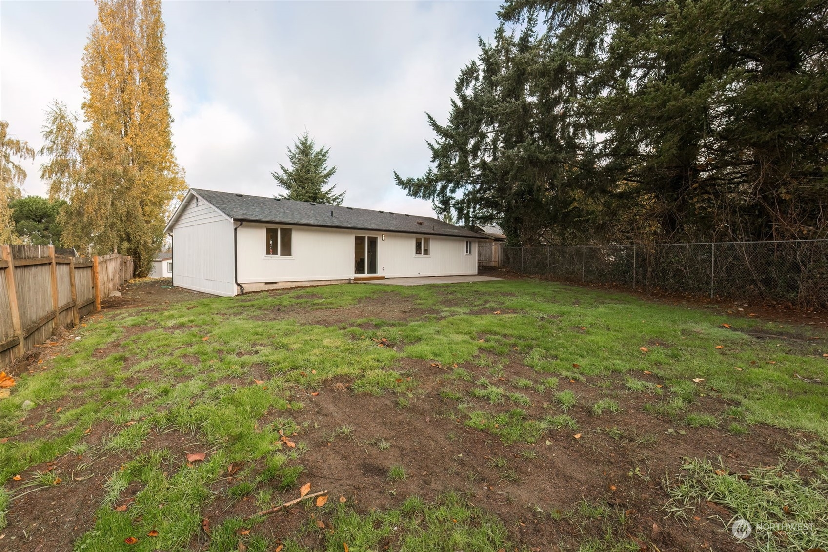 3719 Rhapsody Drive Southeast Port Orchard, WA 98366 - Photo 39 of 40 a view of a house with a yard