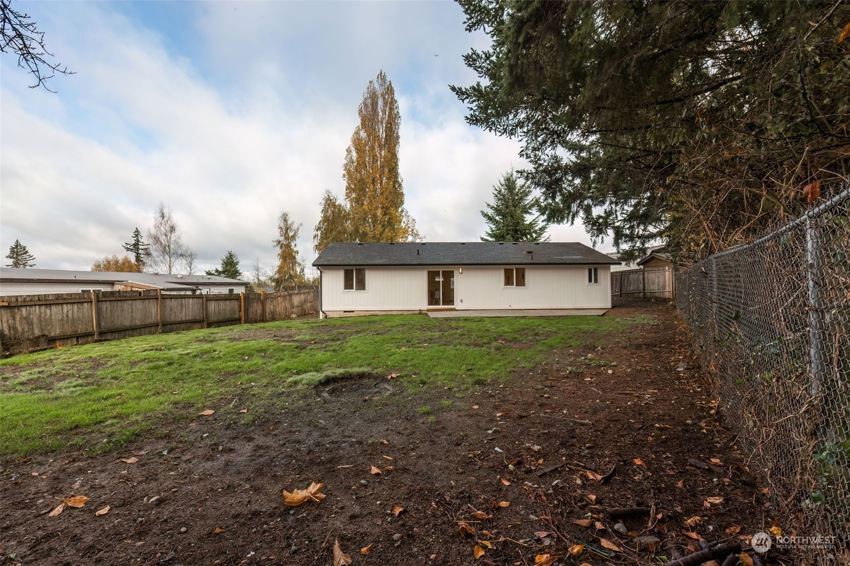 3719 Rhapsody Drive Southeast Port Orchard, WA 98366 - Photo 40 of 40 a view of a house with yard and a garden