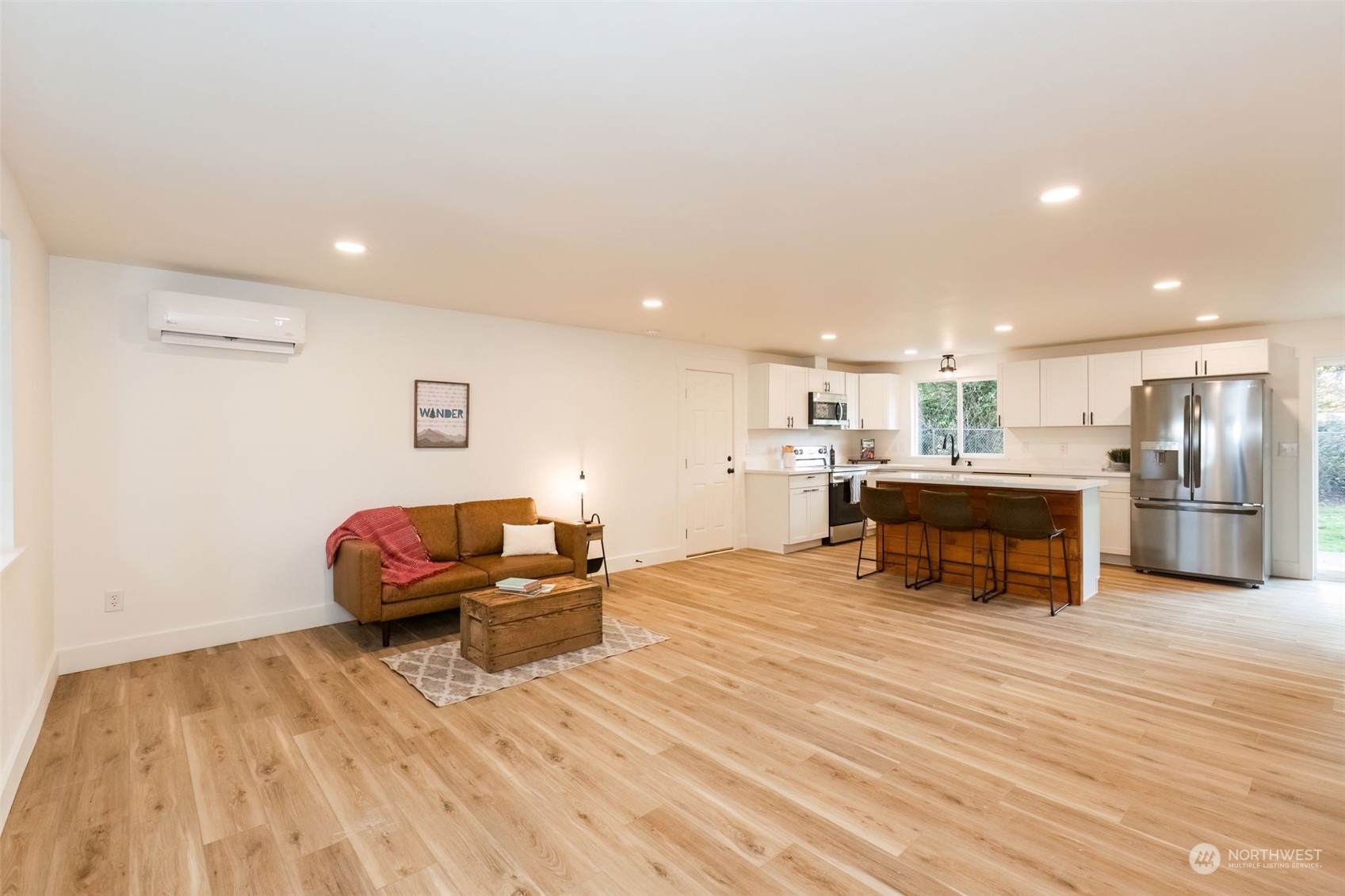 3719 Rhapsody Drive Southeast Port Orchard, WA 98366 - Photo 6 of 40 a living room with furniture and a wooden floor