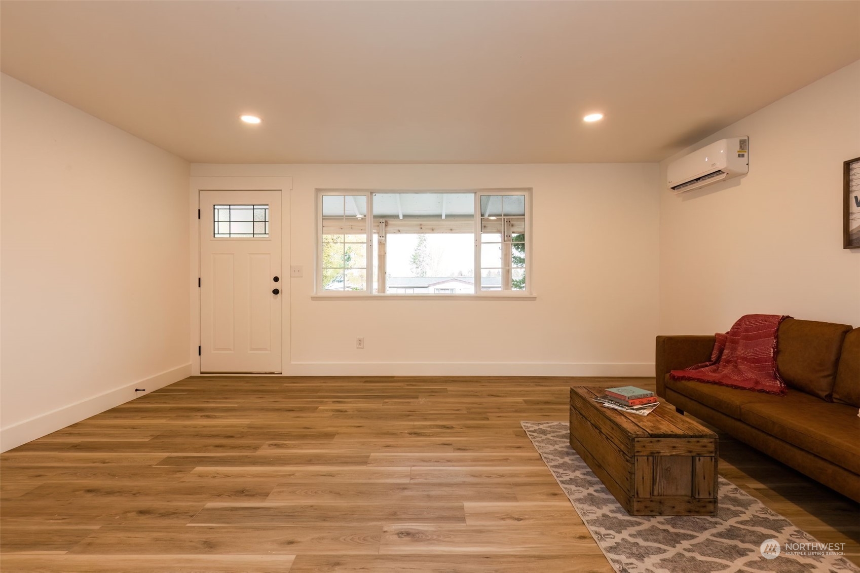 3719 Rhapsody Drive Southeast Port Orchard, WA 98366 - Photo 9 of 40 a view of livingroom with furniture wooden floor and window