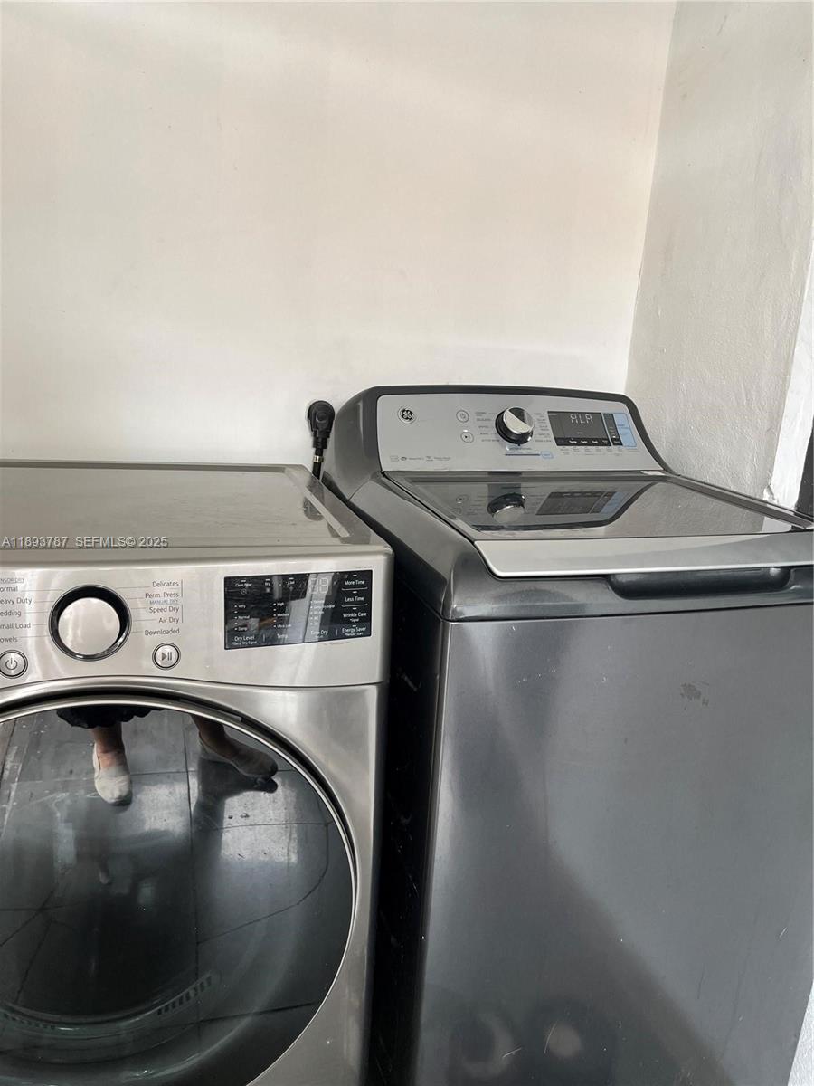 1102 Northwest 103rd Street Miami, FL 33150 - Photo 12 of 37 a utility room with washing machine