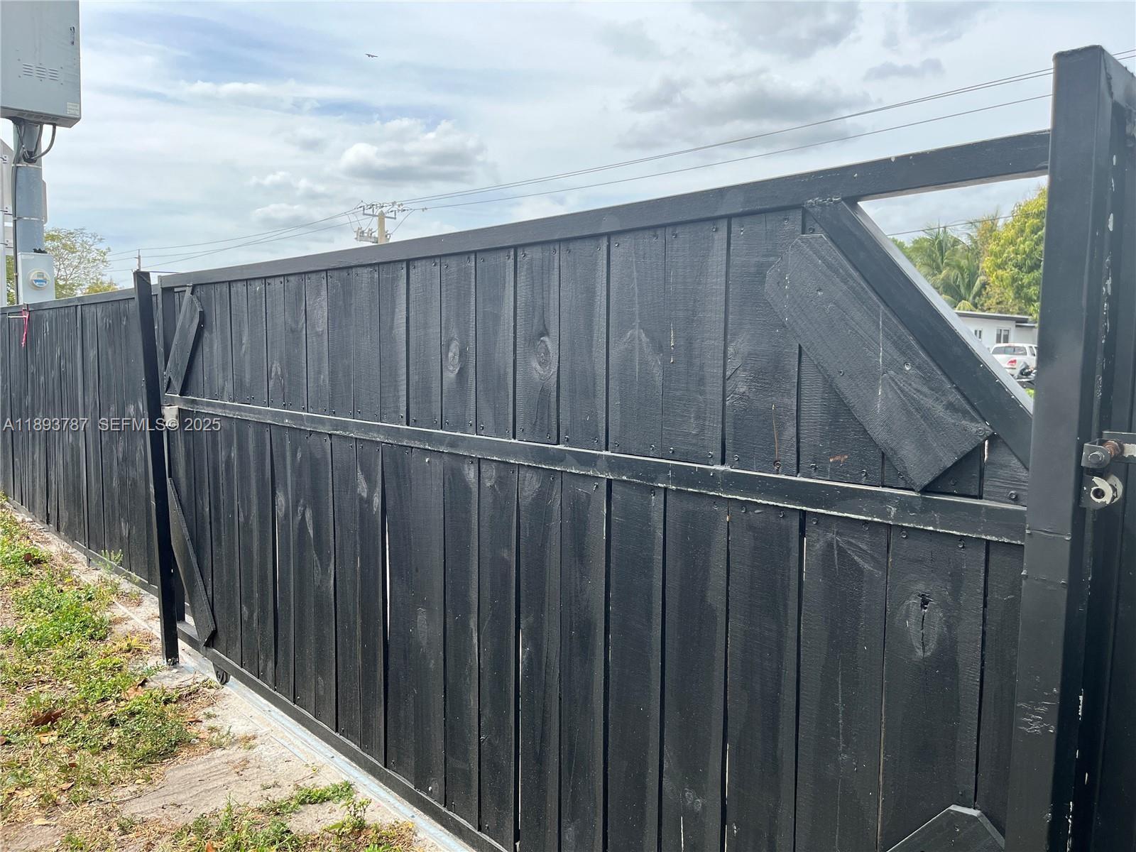 1102 Northwest 103rd Street Miami, FL 33150 - Photo 28 of 37 a view of wooden fence