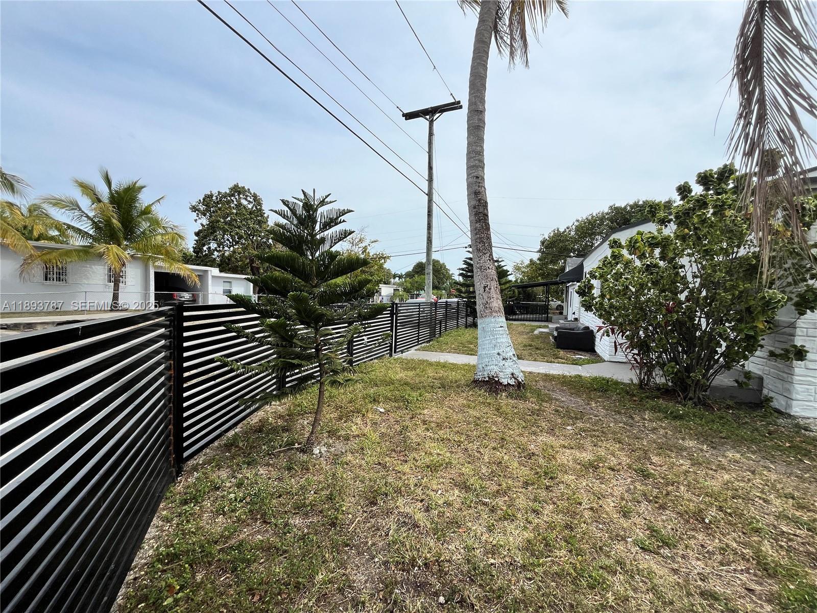 1102 Northwest 103rd Street Miami, FL 33150 - Photo 29 of 37 a view of a yard with plants