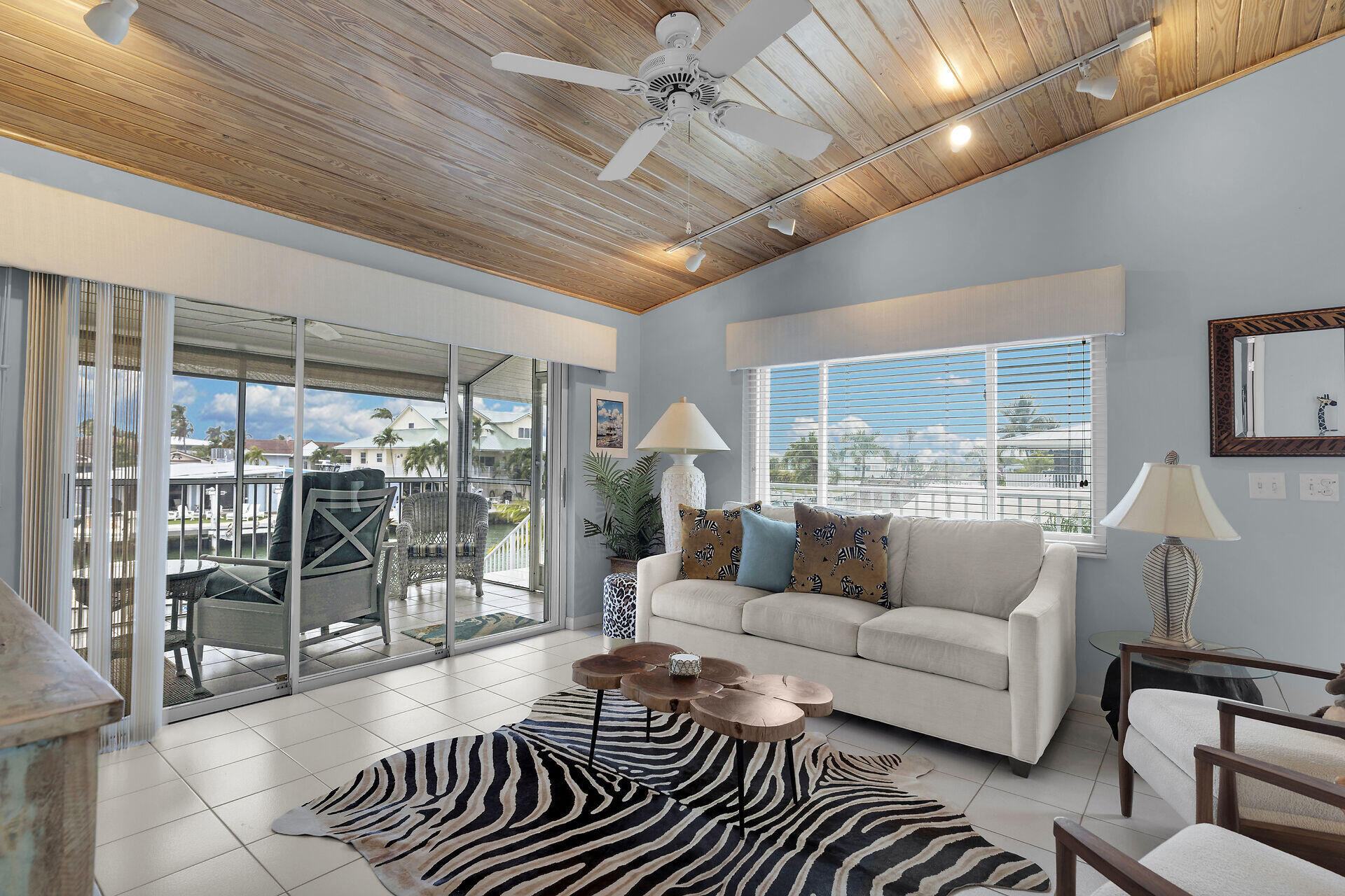 651 9th Street Key Colony Beach, FL 33051 - Photo 13 of 53 a living room with furniture and a glass door