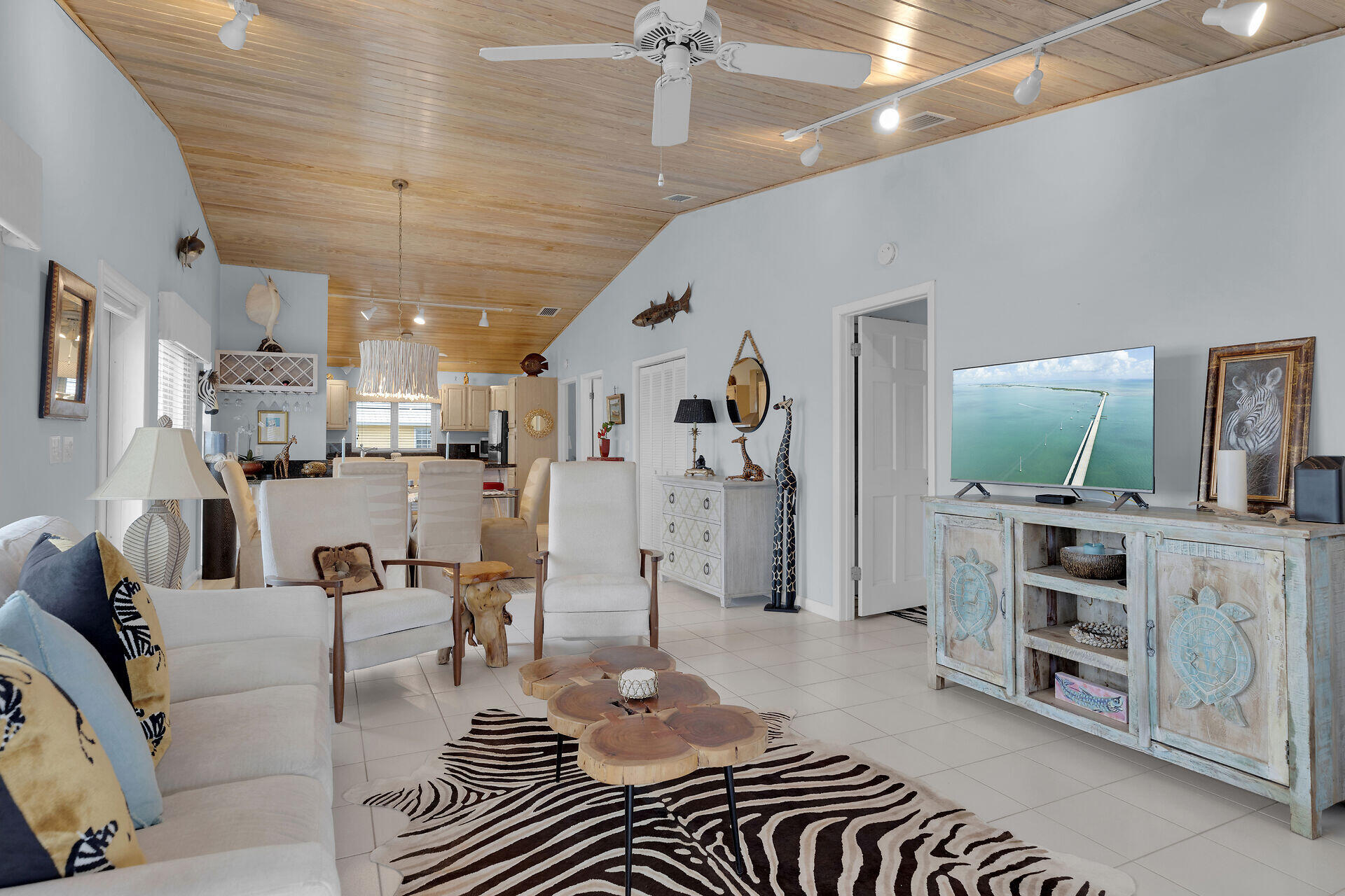 651 9th Street Key Colony Beach, FL 33051 - Photo 15 of 53 a living room with furniture and a flat screen tv