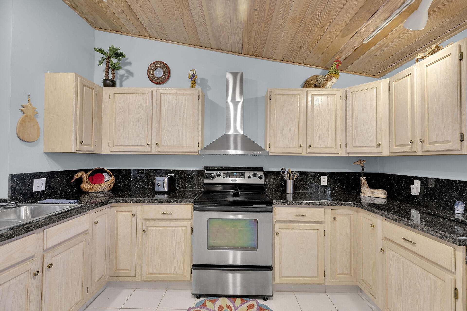 651 9th Street Key Colony Beach, FL 33051 - Photo 21 of 53 a kitchen with white cabinets and white appliances