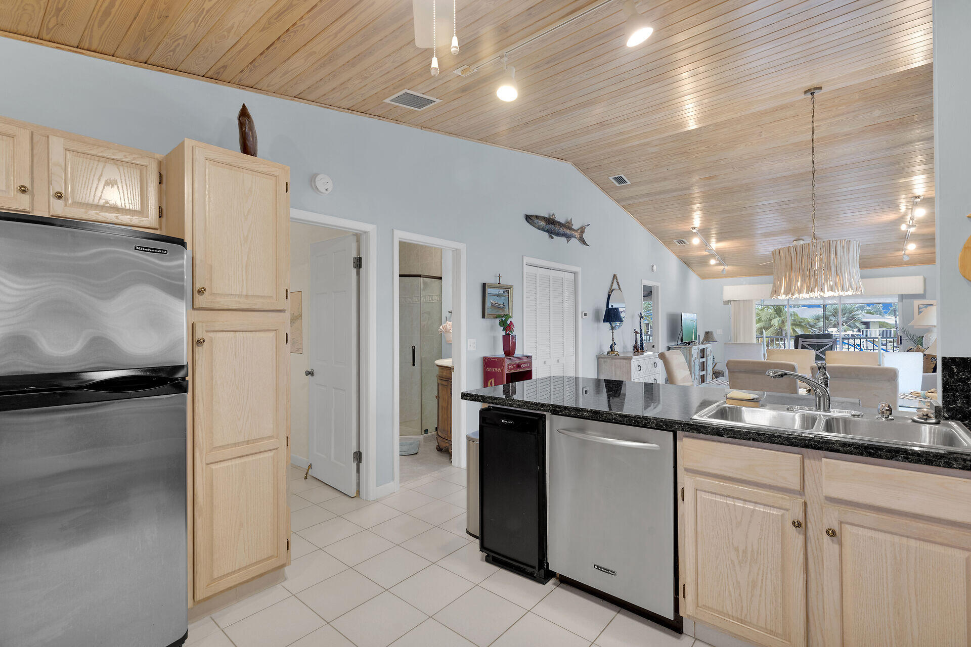 651 9th Street Key Colony Beach, FL 33051 - Photo 22 of 53 a kitchen with stainless steel appliances granite countertop a sink and cabinets