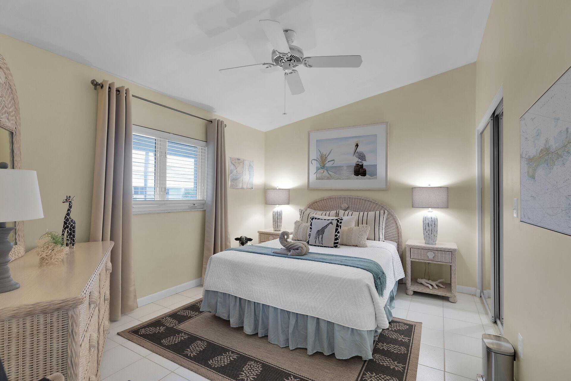 651 9th Street Key Colony Beach, FL 33051 - Photo 29 of 53 a bedroom with a bed and a chandelier