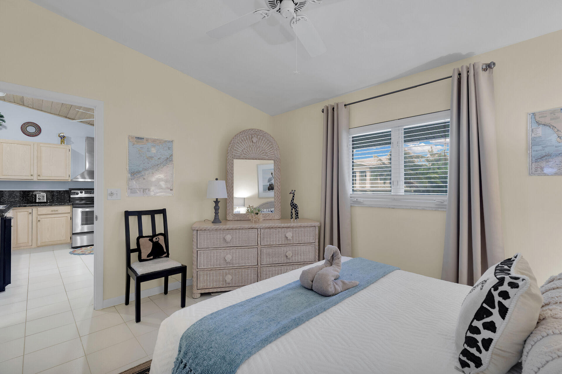 651 9th Street Key Colony Beach, FL 33051 - Photo 30 of 53 a bedroom with a bed and a chandelier