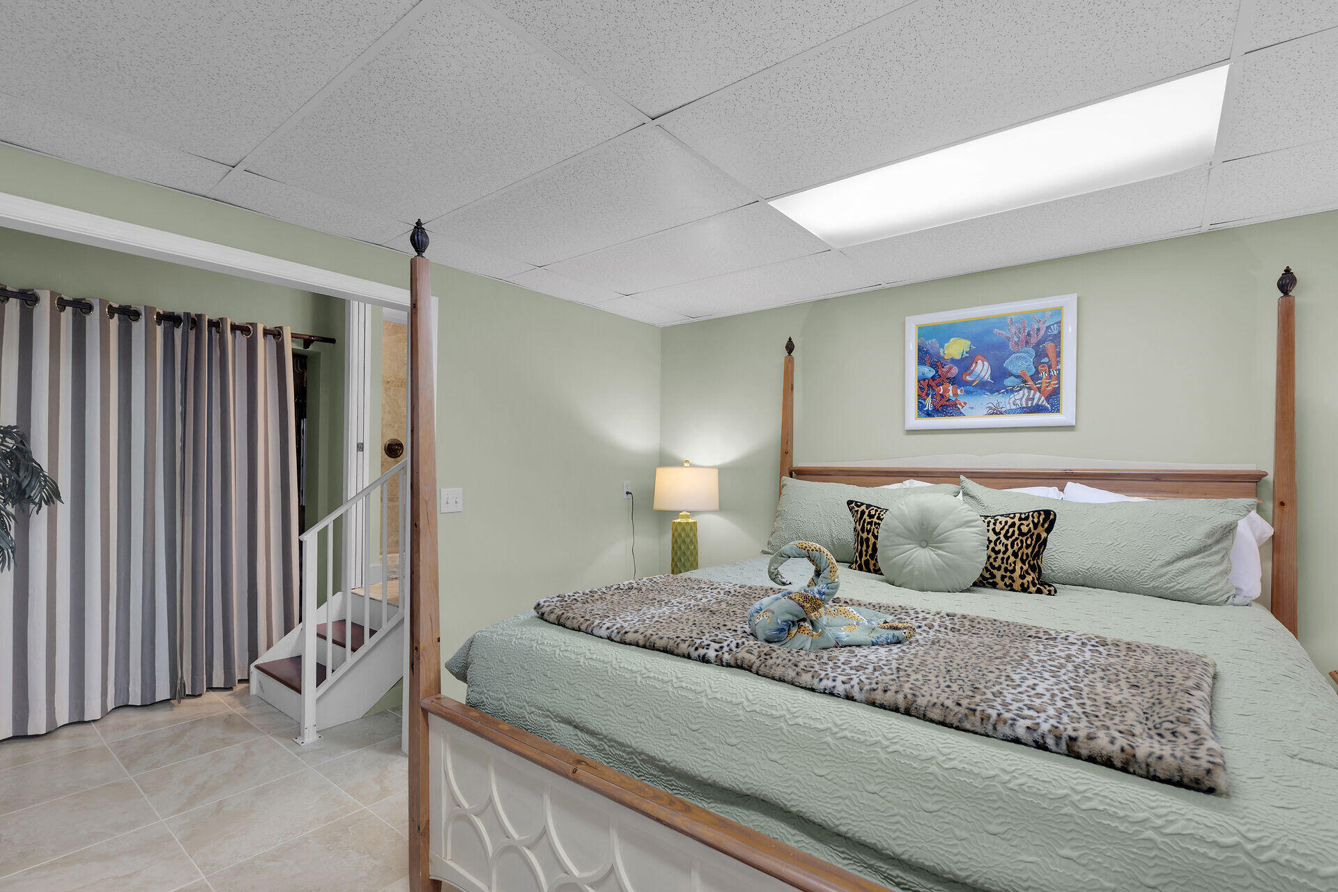 651 9th Street Key Colony Beach, FL 33051 - Photo 36 of 53 a bed room with a bed and a painting