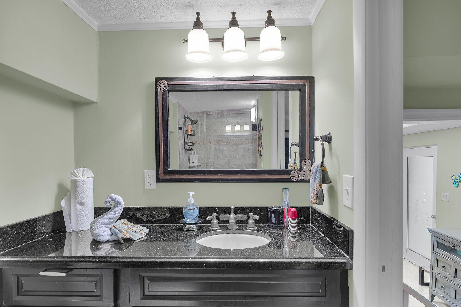 651 9th Street Key Colony Beach, FL 33051 - Photo 39 of 53 a bathroom with a sink and a mirror