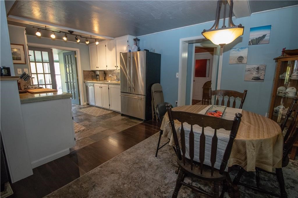 17 Spring Street Westerly, RI 02891 - Photo 16 of 29 Unit 1 lower apartment, oversized kitchen, sunroom, dining area.