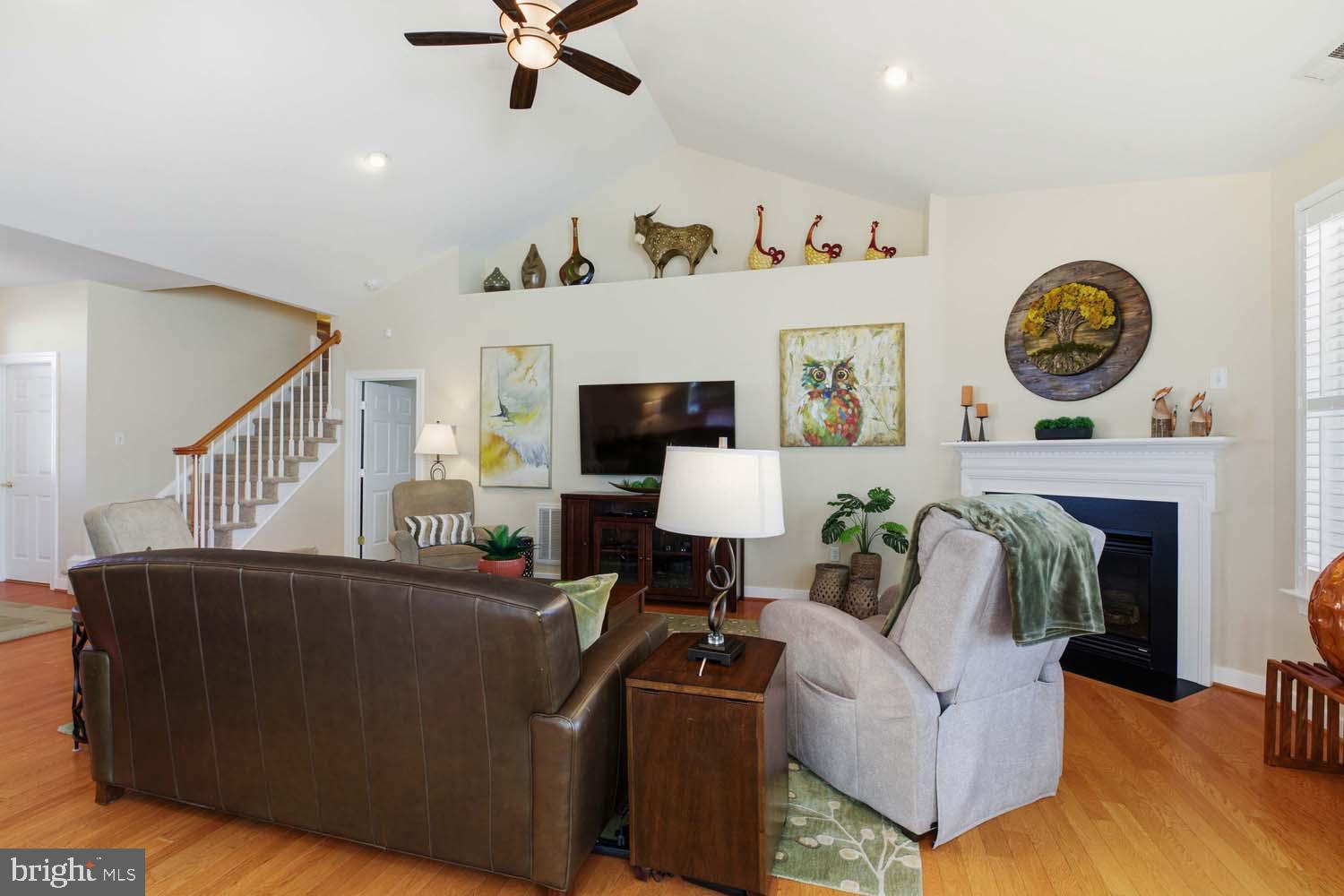 464 Middle Gate Irvington, VA 22480 - Photo 11 of 46 a living room with furniture and a clock