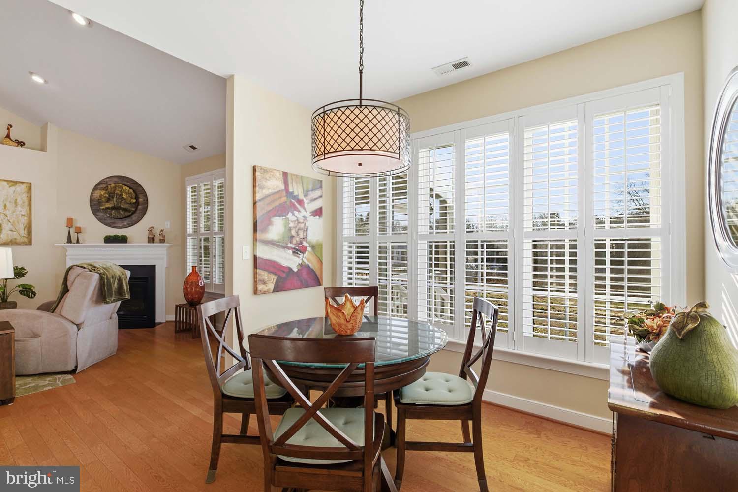 464 Middle Gate Irvington, VA 22480 - Photo 14 of 46 a dining room with furniture and wooden floor
